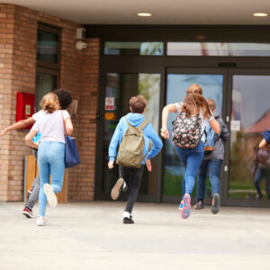Students running into school