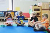 Children sitting in a circle in class