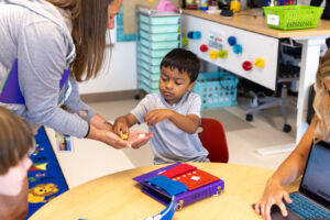 Learner receiving tokens to earn a reinforcer
