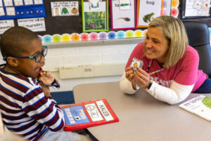 Student and teacher communicating using PECS