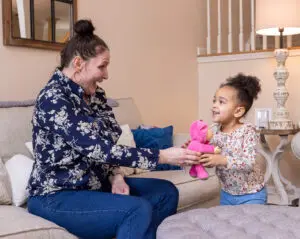 A child receiving a toy she has requested